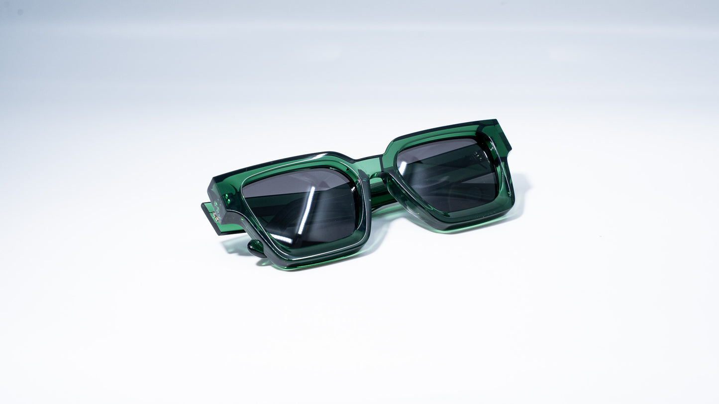Ison Couture Eco Green polarized sunglasses folded on white background