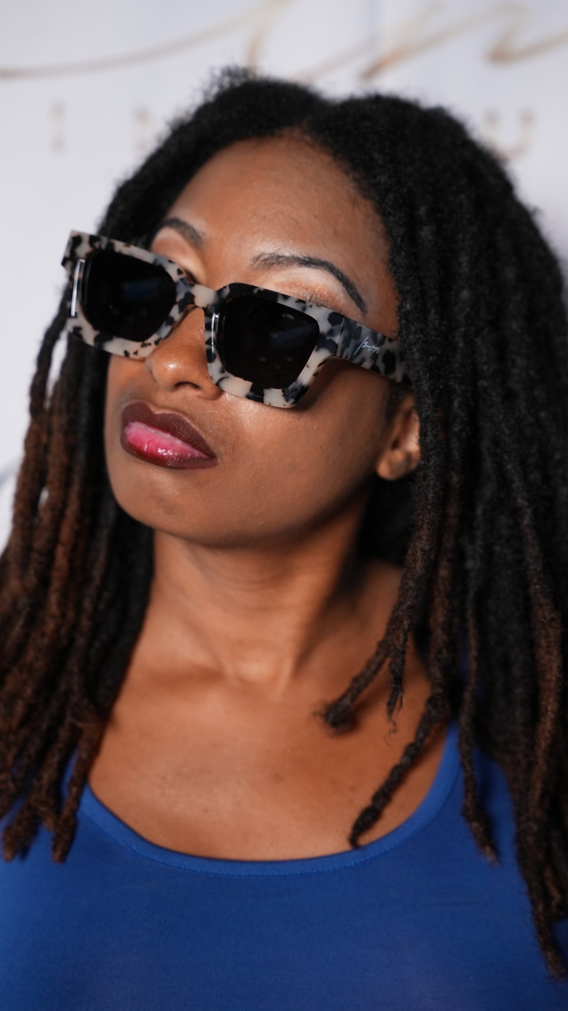 Darkskin miami model wearing leopard style glasses by ison couture