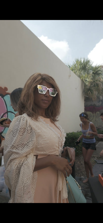 Dark Skin Woman wearing Chrome ison couture square frame sunglasses outside