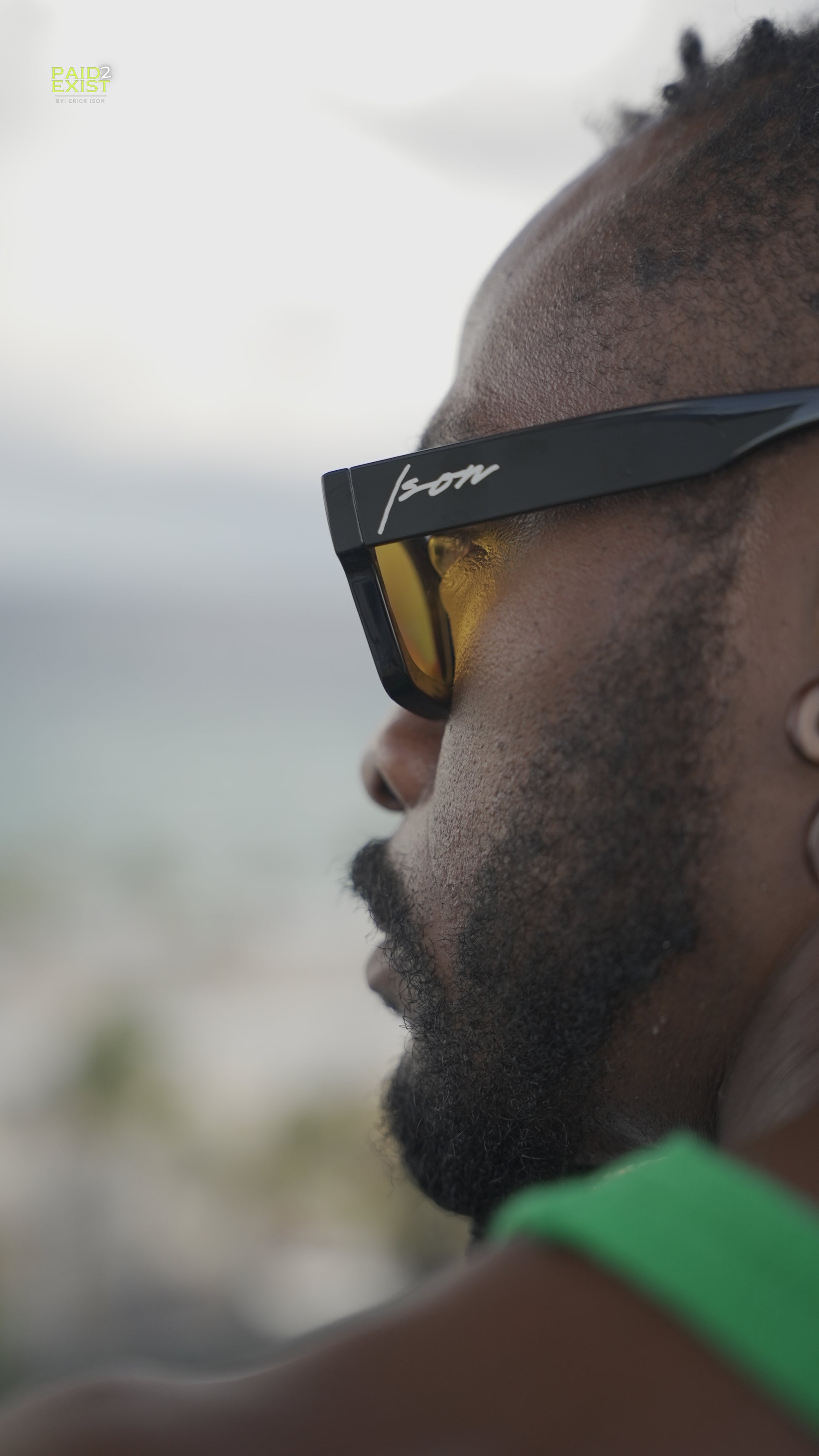 Darkskin Person wearing Ison couture sunrise sunglasses with a