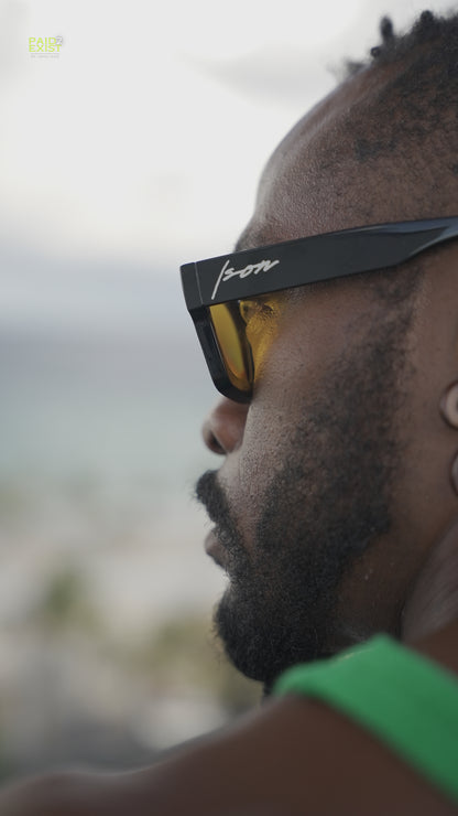 Darkskin Person wearing Ison couture sunrise sunglasses with a
