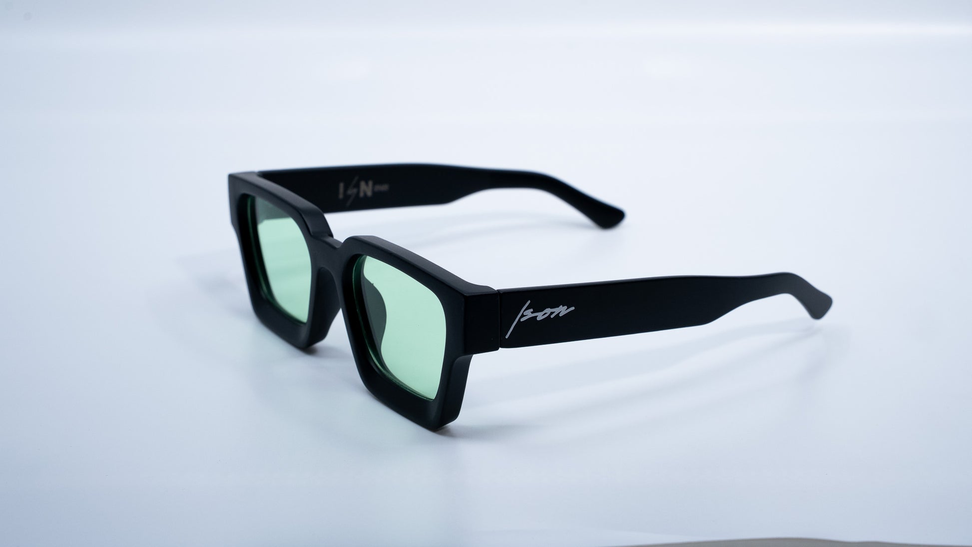 Ison Couture Matte Mint square sunglasses with green lenses side angle view