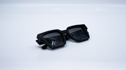 Ison Couture Polar Black polarized sunglasses folded on white background