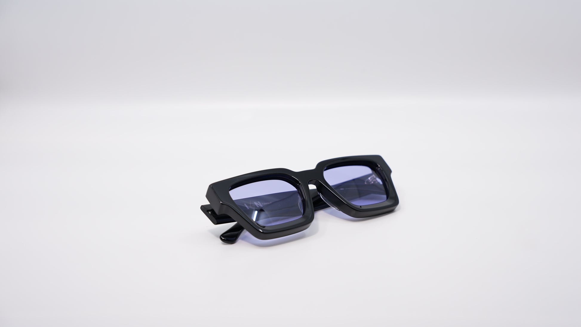 Ison Couture Purple Haze polarized sunglasses folded showing purple lens detail