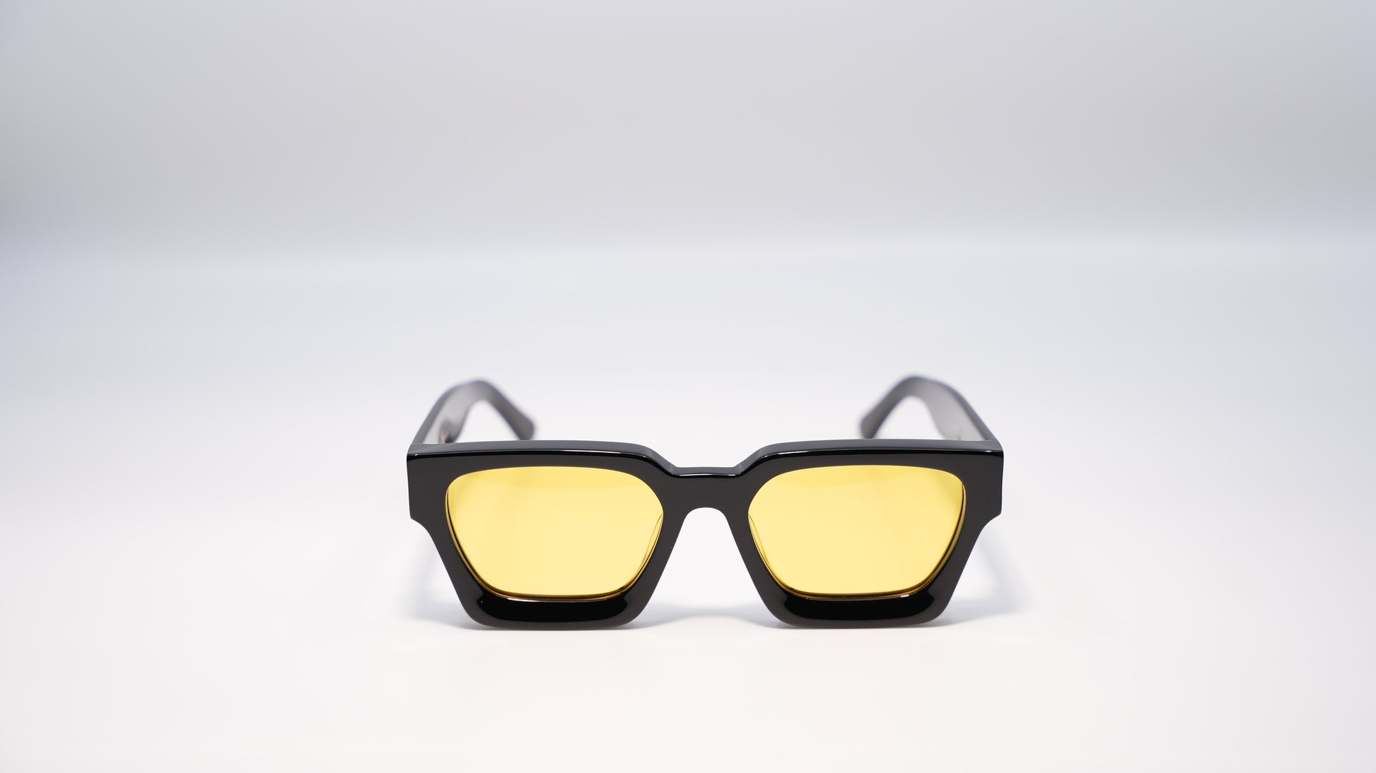 Ison Couture Sunrise polarized sunglasses front view showing yellow lens and warm frame
