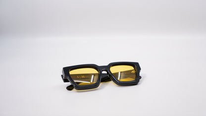 Ison Couture Sunrise polarized sunglasses folded showing yellow lens detail