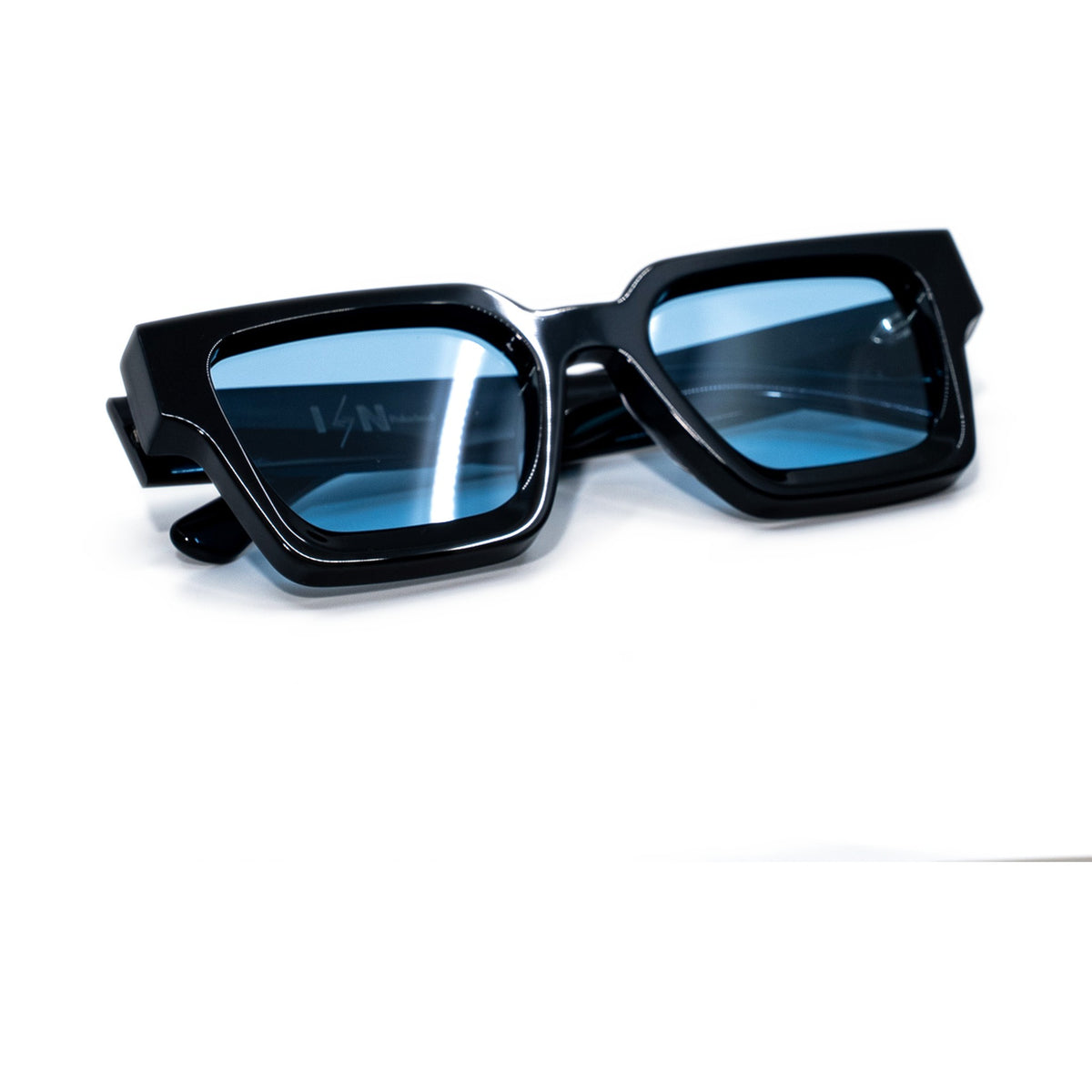 Black & Bleu sunglasses folded, gloss black bio-acetate frame with blue lenses and Ison lens etching