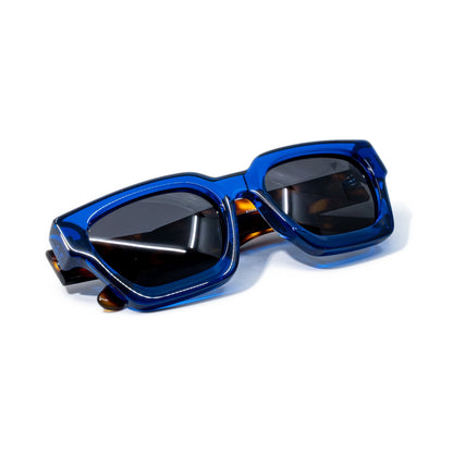 Blue Tortoise sunglasses folded, cobalt blue acetate front with tortoise temples tucked behind