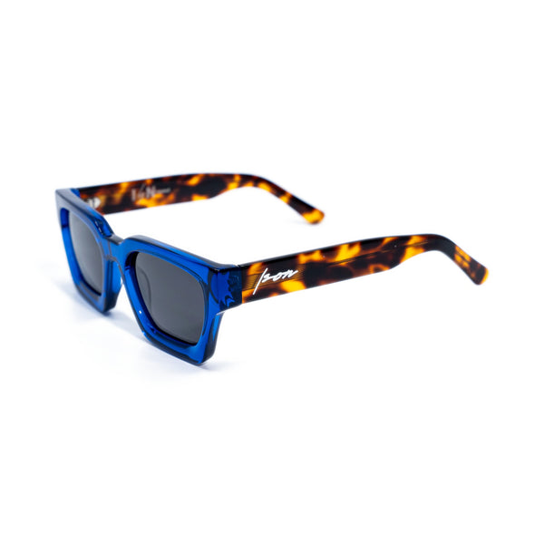 Ison Couture Blue Tortoise polarized sunglasses, translucent cobalt bio-acetate face with amber tortoise temples, three-quarter view