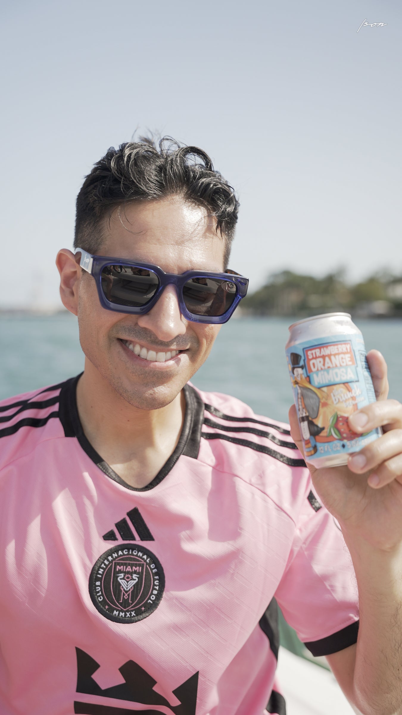 Man wearing Ison Couture Blue Tortoise bold square polarized sunglasses outdoors with INTER Miami jersey