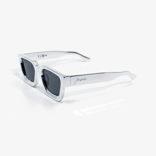 Ison Couture Chrome sunglasses, mirror-polished reflective chrome square frame with dark smoke lenses, three-quarter view