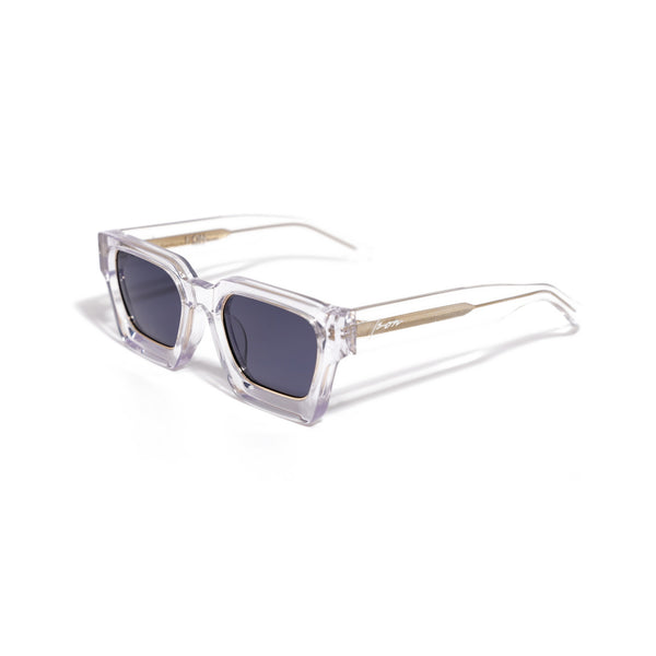 Ison Couture Crystal Clear & Gold polarized sunglasses, transparent bio-acetate square frame with engraved gold core rod, three-quarter view