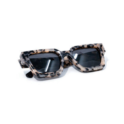 Granite sunglasses folded, sand and charcoal speckled bio-acetate with dark smoke lenses