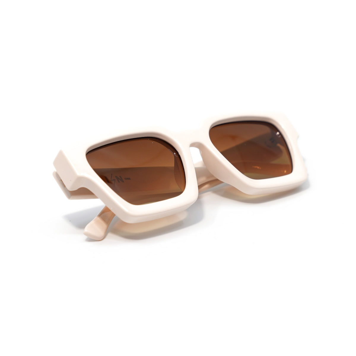 Krispy Crème sunglasses folded, matte cream frame with brown gradient lenses