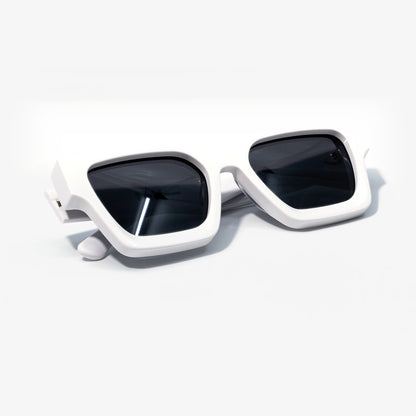 Polar White sunglasses folded, smooth white bio-acetate frame with dark smoke lenses