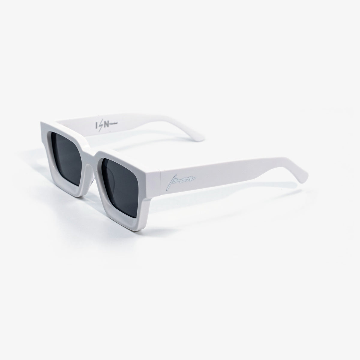 Ison Couture Polar White polarized sunglasses, solid white bio-acetate square frame with dark smoke lenses, three-quarter view