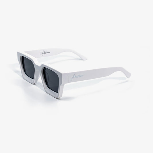 Ison Couture Polar White polarized sunglasses, solid white bio-acetate square frame with dark smoke lenses, three-quarter view