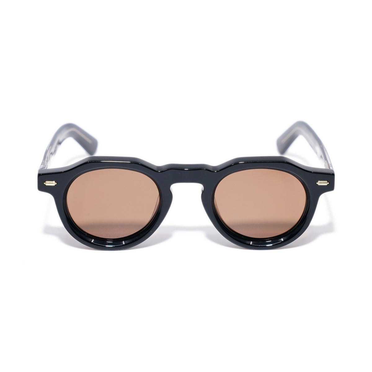 Round Black & Gold sunglasses front view, keyhole bridge and faceted round rims with warm brown polarized lenses