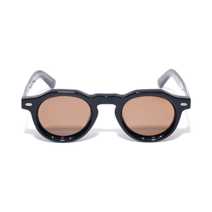 Round Black & Gold sunglasses front view, keyhole bridge and faceted round rims with warm brown polarized lenses