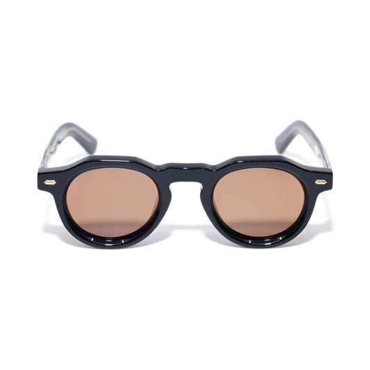 Round Black & Gold sunglasses front view, keyhole bridge and faceted round rims with warm brown polarized lenses