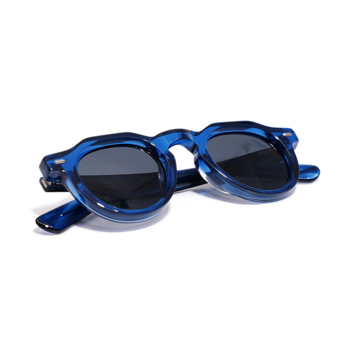 Round & Cobalt sunglasses folded, cobalt keyhole-bridge round frame with smoke gray lenses