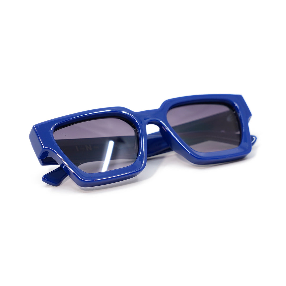 Royal Blue sunglasses folded, high-gloss royal blue frame with smoke gradient lenses
