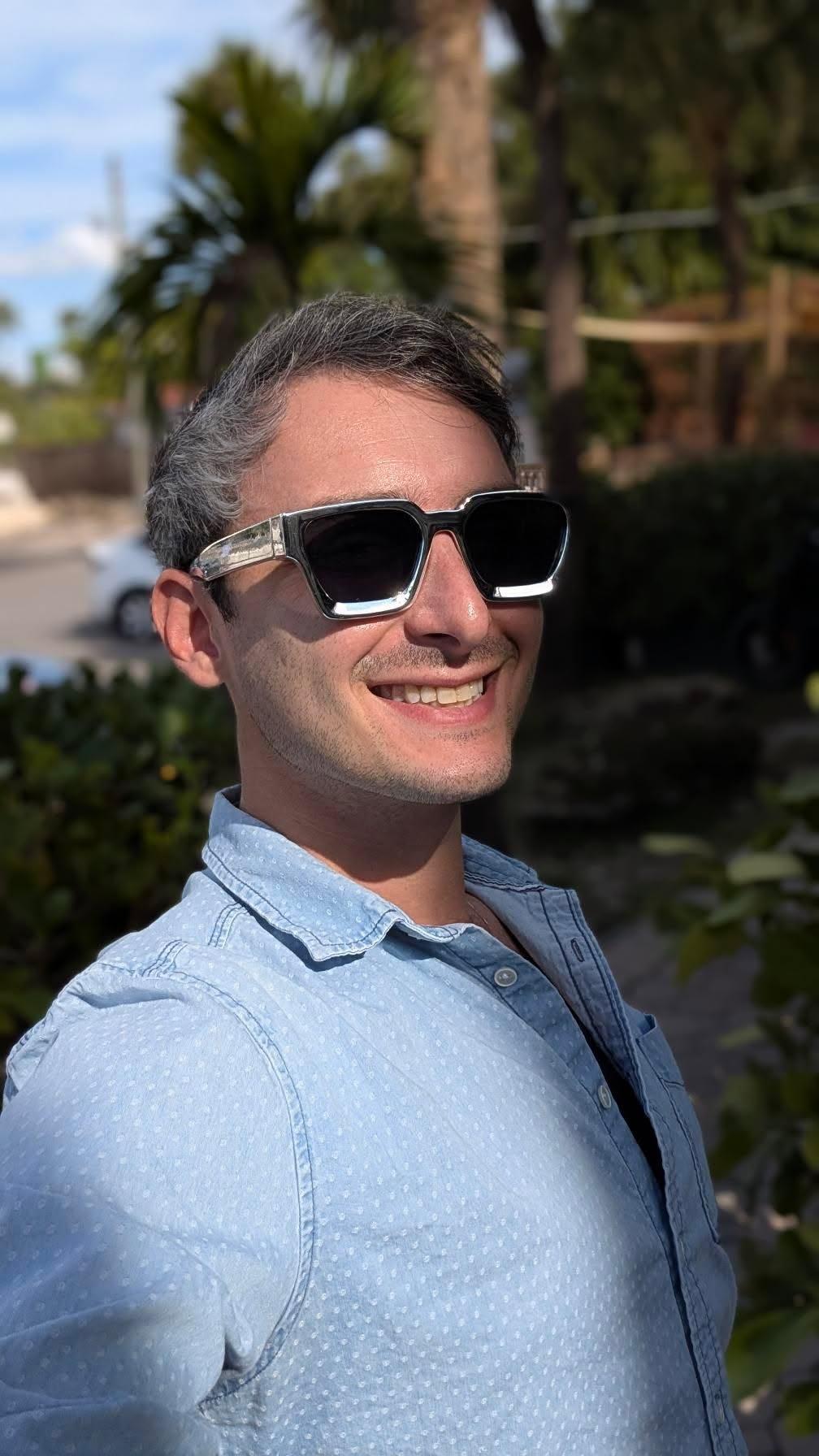 Man smiling wearing Ison Couture Chrome bold silver square sunglasses